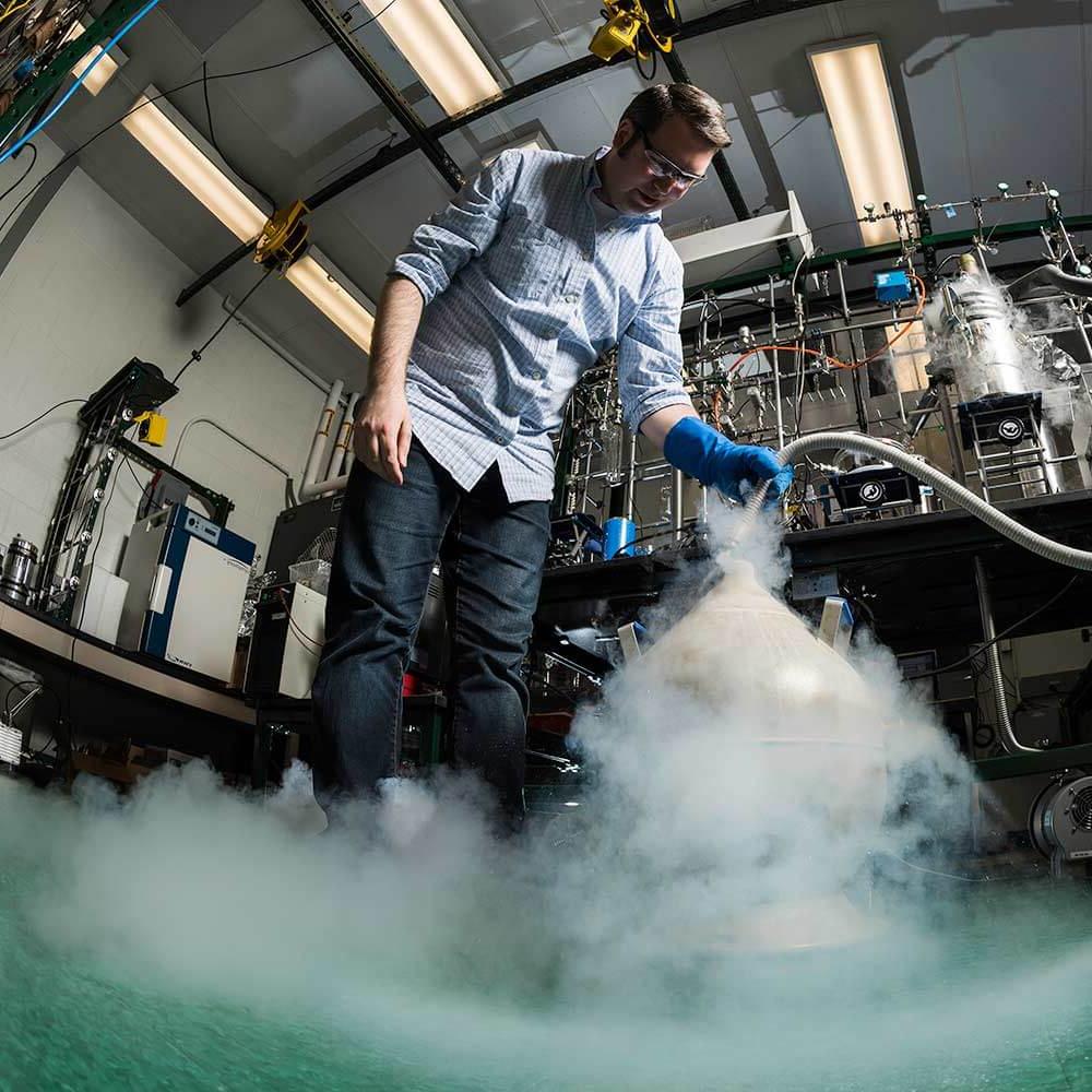 researcher using dry ice in a lab setting